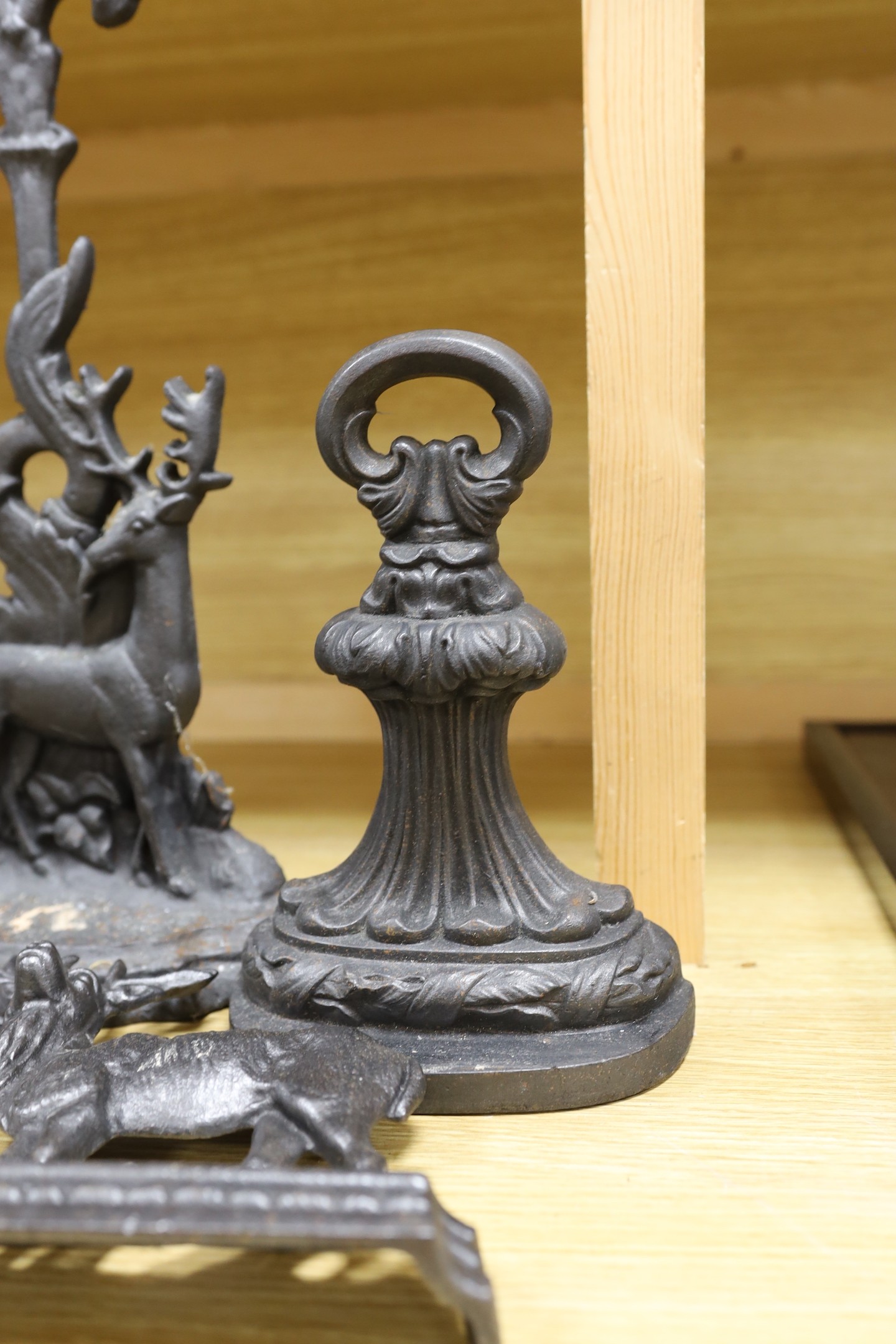 5 cast iron door stops, three of deer, tallest 39.5 cms high